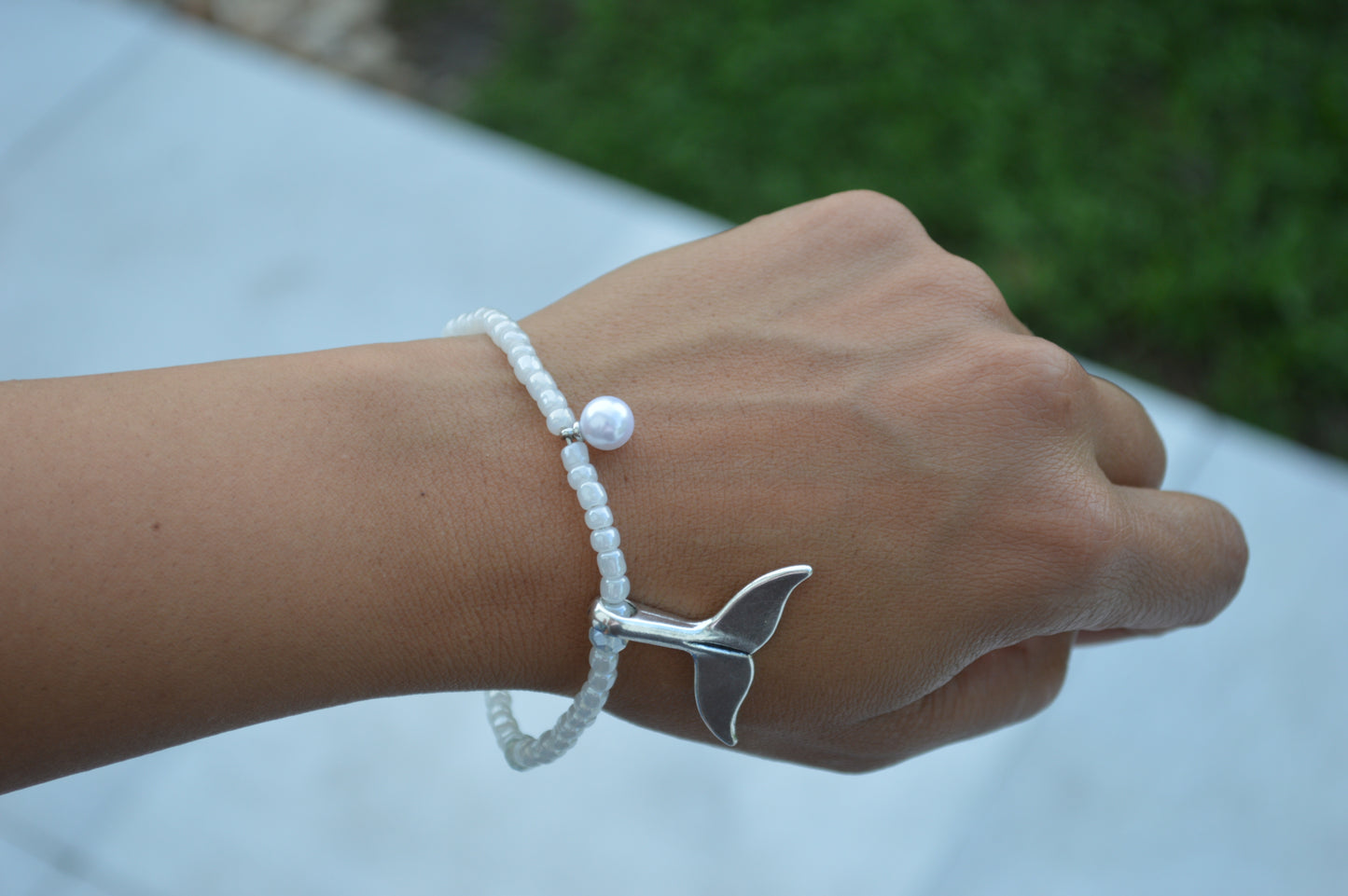 Dolphin tail charm bracelet